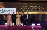 Clark Development Corporation (CDC) Health and Sanitation Division Nurse II Sarah Rucks receives the Universal Health Care Champion award on behalf of the corporation during PhilHealth’s Regional Recognition Program held on November 20 at the Kingsborough International Convention Center in the City of San Fernando, Pampanga.
