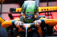 PREPARATIONS begin as Lando Norris settles into his McLaren in Las Vegas.