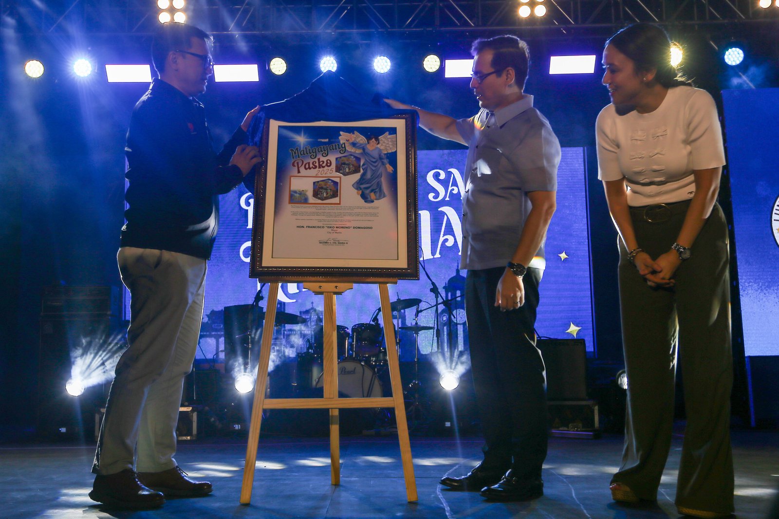 Manila City Mayor Francisco "Isko" Moreno, together with Vice-Mayor Angela Lei "Chi" Atienza, leads the unveiling of a commemorative stamp and lighting of a Christmas tree at the Kartilya ng Katipunan in Manila Friday evening to officially start the city-wide Christmas celebration.