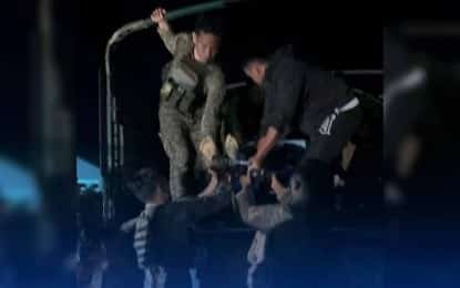 Soldiers load into a truck the body of a fallen comrade during a clash in San Jose de Buan, Samar, on Dec. 3, 2025. The Philippine Army’s 8th Infantry Division has condemned the New People’s Army for what it described as “heinous violations” of International Humanitarian Law (IHL), following the recent armed encounter that killed two soldiers. (Photo from FB page of Kiss FM 103.7 Catarman)