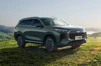 PEAK view shows the Tiggo rEV set against open hills as Chery marks a strong month in the plug-in hybrid market.