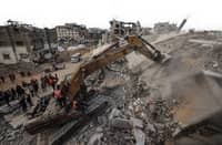 CIVIL defense workers use an excavator to search for the remains of victims in the rubble of a destroyed building in the Bureij refugee camp, in the central Gaza Strip, on 6 December 2025. Qatar and Egypt, guarantors of the Gaza ceasefire, called for the withdrawal of Israeli troops and the deployment of an international stabilization force as the necessary next steps in fully implementing the fragile ceasefire agreement.