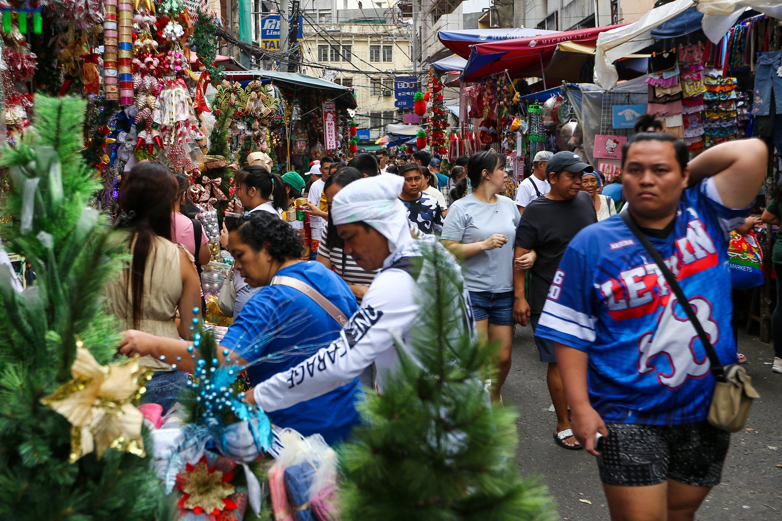 Shoppers flock to Divisoria in Manila on Sunday, 07 December 2025, as the holiday rush builds with Christmas fast approaching.