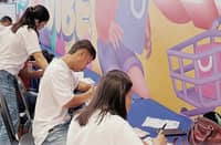 YOUTHS register as voters for the 2026 Sangguniang Kabataan election at SM City Batangas.