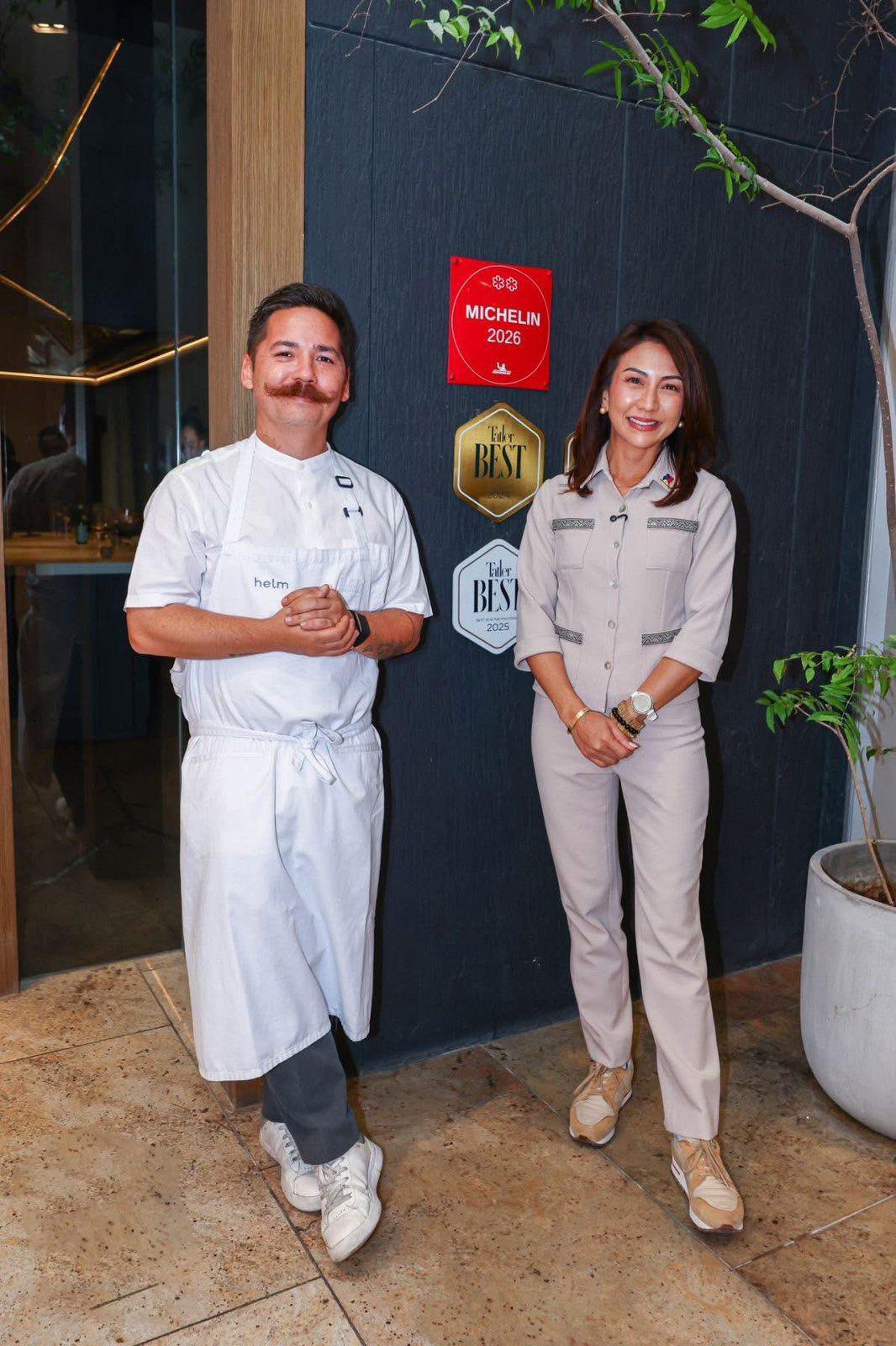TOURISM Secretary Christina Garcia Frasco delivers the two-star Michelin plaque to Helm’s Chef Josh Boutwood, celebrating the restaurant’s milestone achievement in the inaugural Michelin Guide Philippines during the RestoRUN Caravan.