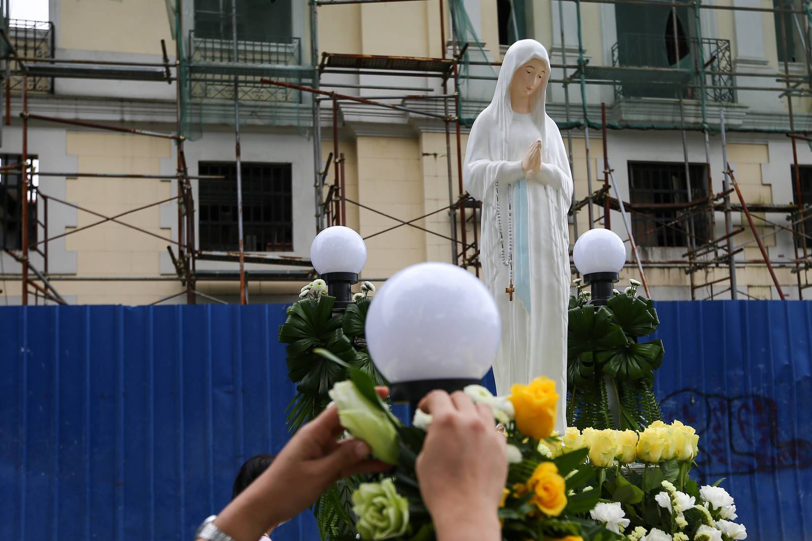 Members of the Sisters of Mary Congregation in Silang, Cavite, prepare their patroness, Our Lady of Banneux — also known as Our Lady of the Poor — by adorning her image ahead of the Grand Marian Procession in Intramuros, Manila, on Sunday afternoon, 07 December 2025.