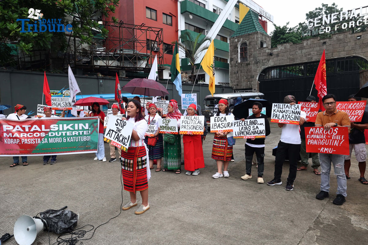 Militant and Indigenous groups stage a protest along EDSA outside Camp Aguinaldo in Quezon City on Monday, December 8, 2025, to mark Indigenous Peoples and Moro Human Rights Day. The groups called for action on alleged intensifying human rights violations, corruption scandals, and the funneling of AFP, NTF-ELCAC, and Barangay Development Program funds into militarization and CAFGU operations—amid rising reports of enforced disappearances, killings and political persecution.