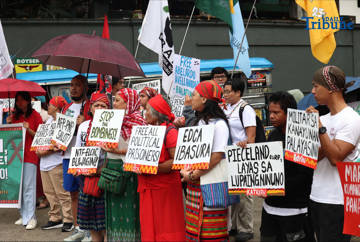 Militant and Indigenous groups stage a protest along EDSA outside Camp Aguinaldo in Quezon City on Monday, December 8, 2025, to mark Indigenous Peoples and Moro Human Rights Day. The groups called for action on alleged intensifying human rights violations, corruption scandals, and the funneling of AFP, NTF-ELCAC, and Barangay Development Program funds into militarization and CAFGU operations—amid rising reports of enforced disappearances, killings and political persecution.