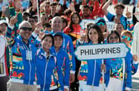 MEMBERS of the national team cheer as they raise the Philippine flag for the first time, signaling their readiness to compete for pride and glory in the 33rd Southeast Asian Games in Bangkok that will formally open on Tuesday evening at the Rajamangala National Stadium.