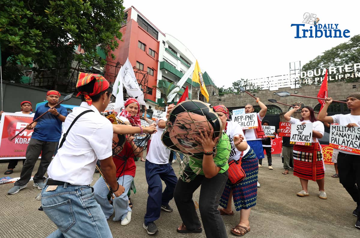 Militant and Indigenous groups stage a protest along EDSA outside Camp Aguinaldo in Quezon City on Monday, December 8, 2025, to mark Indigenous Peoples and Moro Human Rights Day. The groups called for action on alleged intensifying human rights violations, corruption scandals, and the funneling of AFP, NTF-ELCAC, and Barangay Development Program funds into militarization and CAFGU operations—amid rising reports of enforced disappearances, killings and political persecution.