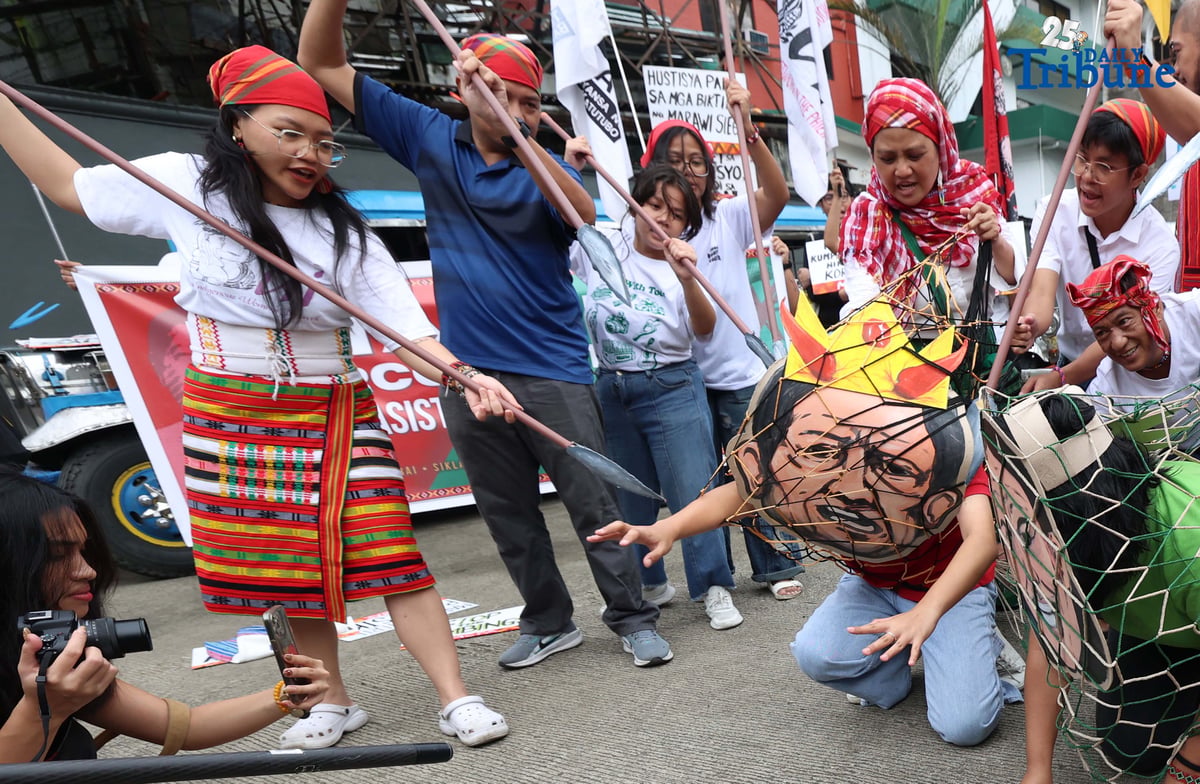 Militant and Indigenous groups stage a protest along EDSA outside Camp Aguinaldo in Quezon City on Monday, December 8, 2025, to mark Indigenous Peoples and Moro Human Rights Day. The groups called for action on alleged intensifying human rights violations, corruption scandals, and the funneling of AFP, NTF-ELCAC, and Barangay Development Program funds into militarization and CAFGU operations—amid rising reports of enforced disappearances, killings and political persecution.