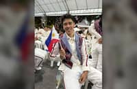 BRYAN Bagunas is honored to carry the national flag during the parade of nations of the 33rd Southeast Asian Games on Tuesday evening at the Rajamangala Stadium in Bangkok.