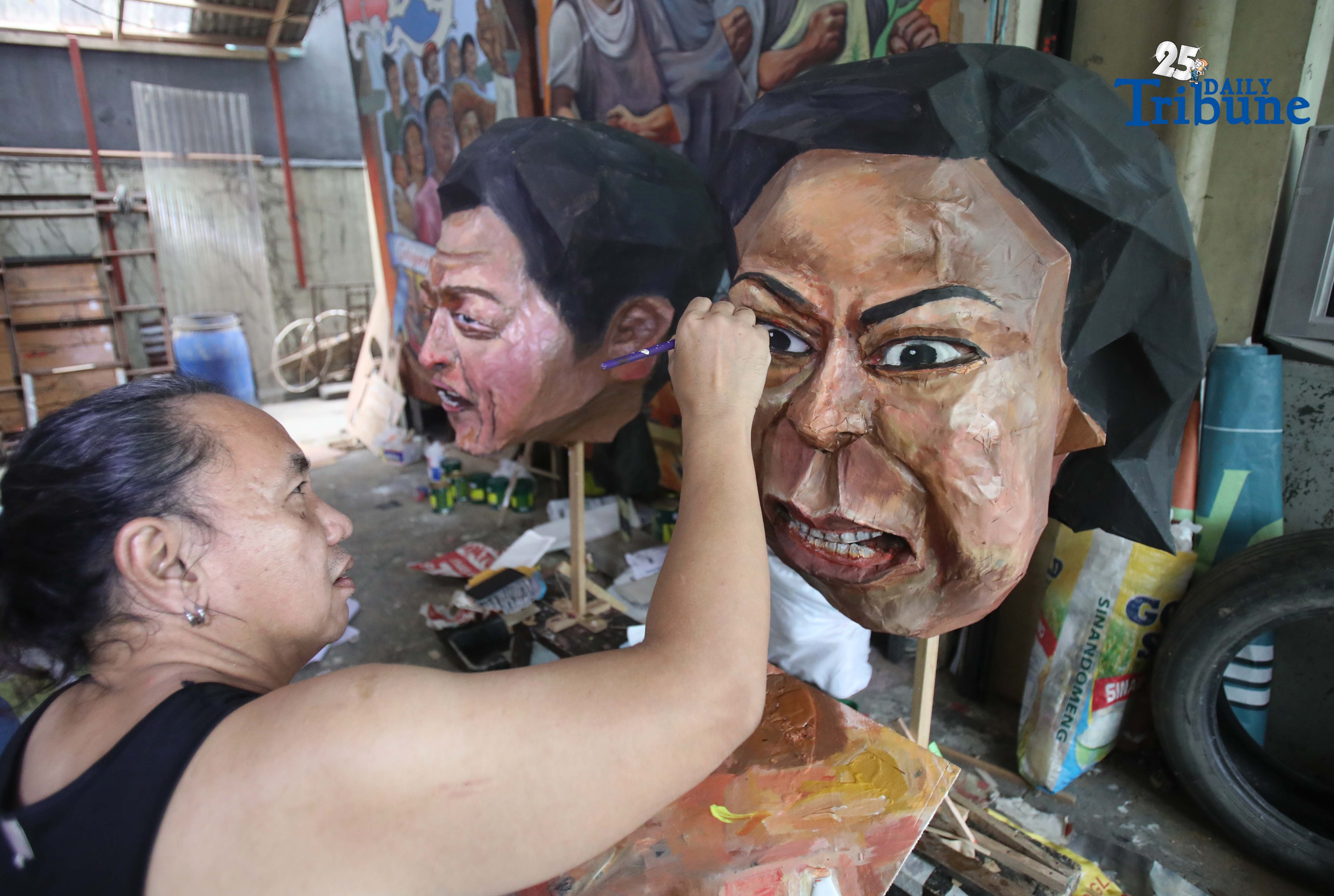 Artist completes effigies of Marcos, Duterte for human rights protest