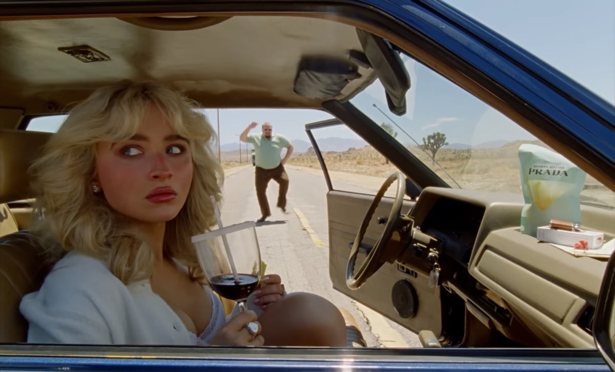 A close-up reveals the meticulous styling and expressive control that define the video’s aesthetic, underscoring Sabrina’s growing command as a visual storyteller. — Youtube/ Sabrina Carpenter