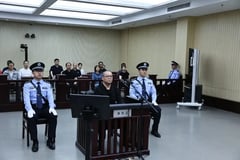 China executes former senior banker for taking $156M bribes