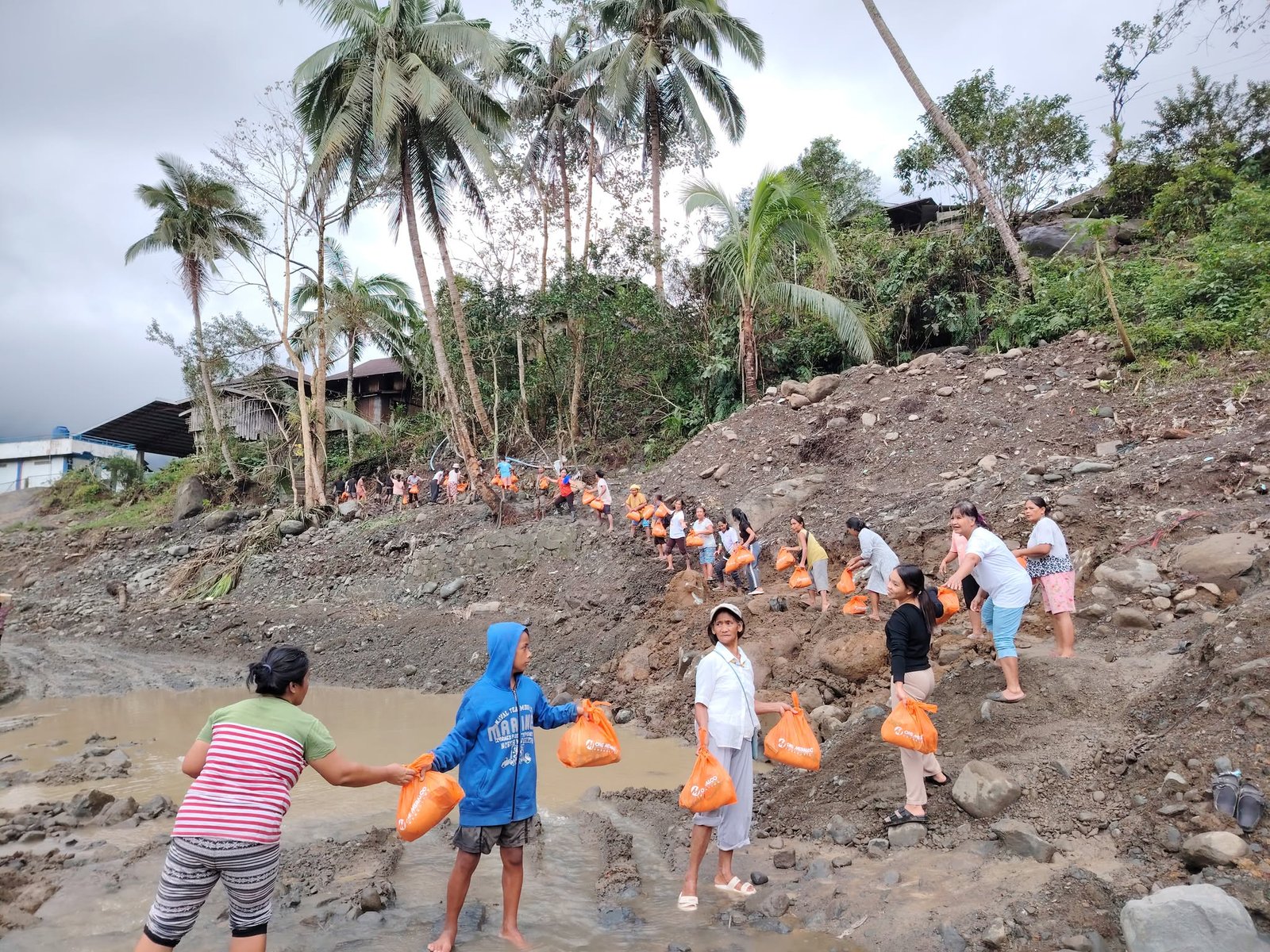 IN Tanudan, Kalinga where bridges were destroyed due to super typhoon ‘Uwan,’ bayanihan became the bridge for residents to receive OMF relief packs.