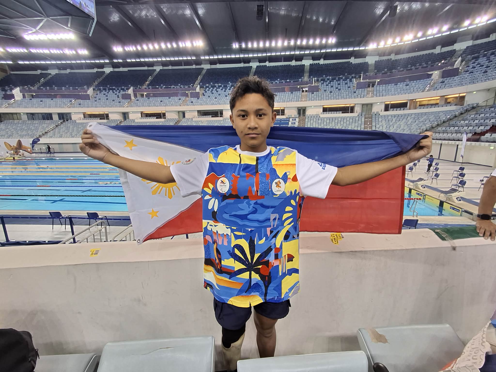 RIC Daniel Pasadilla celebrates after winning the gold medal in the boys 12-16 200-meter individual medley SM 4-14 multi-class event of the Asian Youth Para Games at the Hamdan Sports Complex in Dubai on Friday.