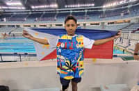 RIC Daniel Pasadilla celebrates after winning the gold medal in the boys 12-16 200-meter individual medley SM 4-14 multi-class event of the Asian Youth Para Games at the Hamdan Sports Complex in Dubai on Friday.