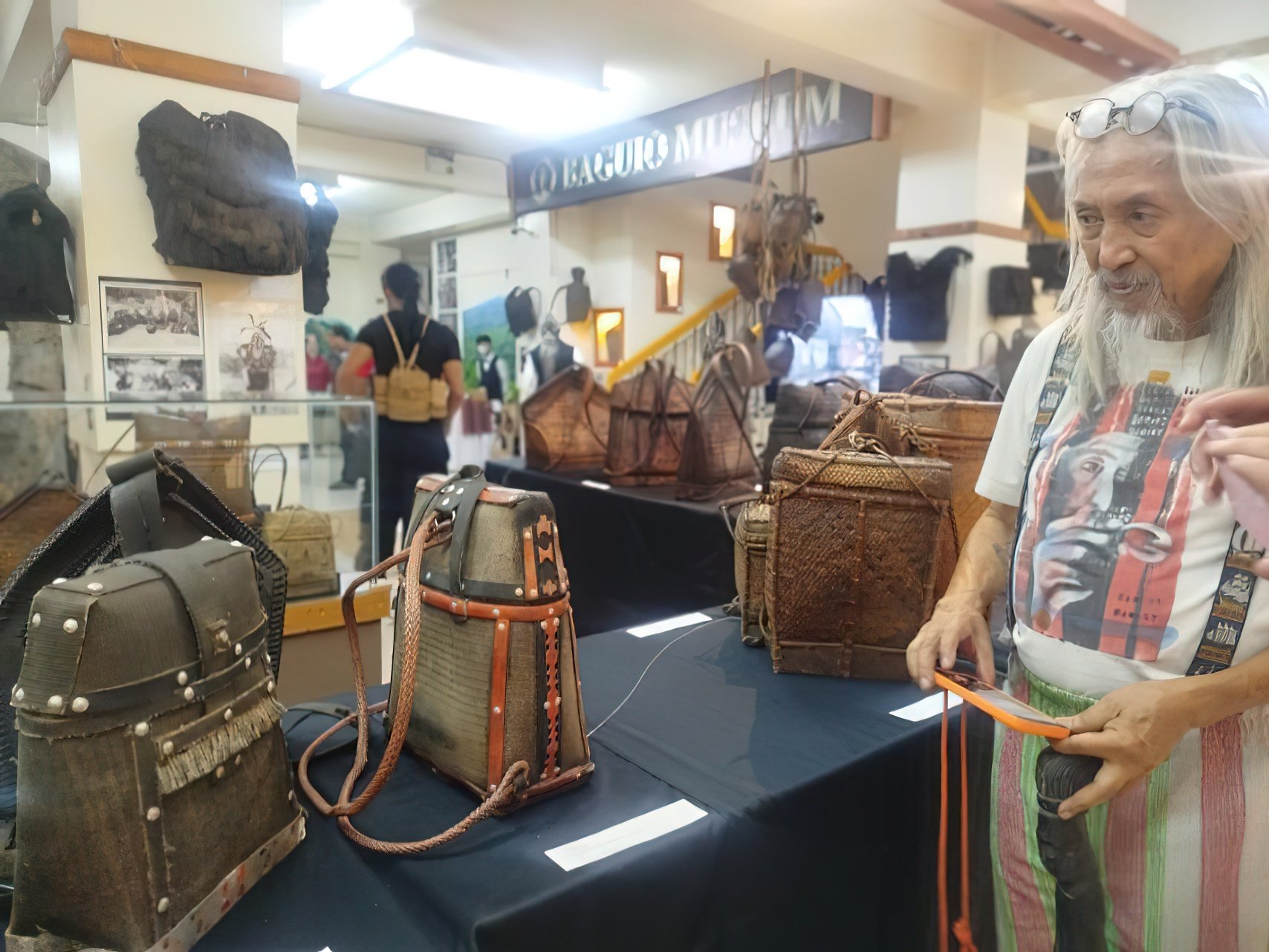 NATIONAL Artist Eric ‘Kidlat Tahimik’ de Guia marvels at the ingenuity behind the traditional ‘pasiking’ — an indigenous backpack crafted from recycled conveyor belts used in the gold mines of the Cordillera.