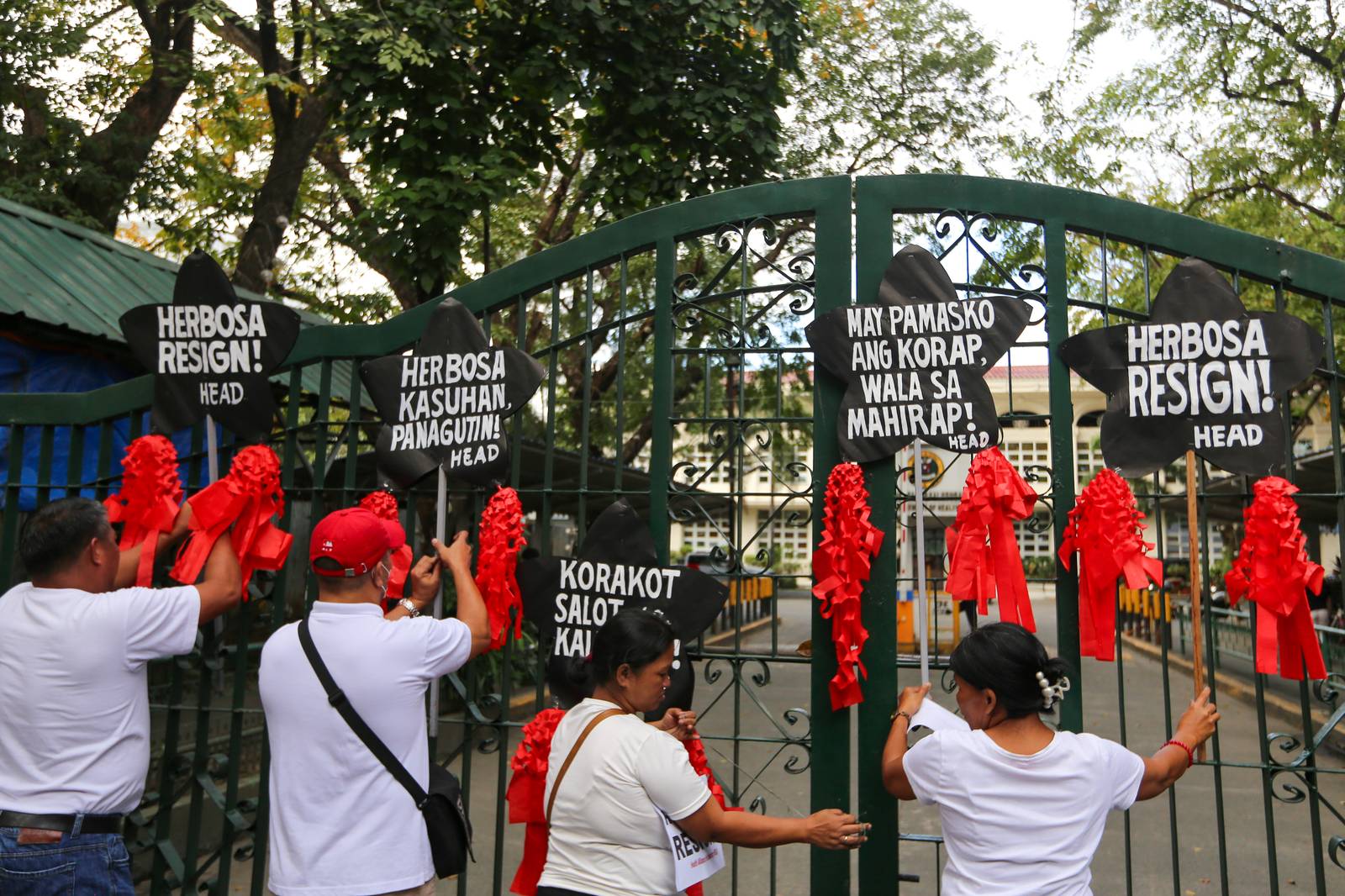Health advocates stage a symbolic protest using Christmas lanterns outside the Department of Health office in Santa Cruz, Manila on Monday, December 15, 2025, calling for the resignation of Health Secretary Teodoro Herbosa amid alleged anomalies at the agency. The group also pressed for transparency and accountability in the use of the ₱60-billion PhilHealth budget.