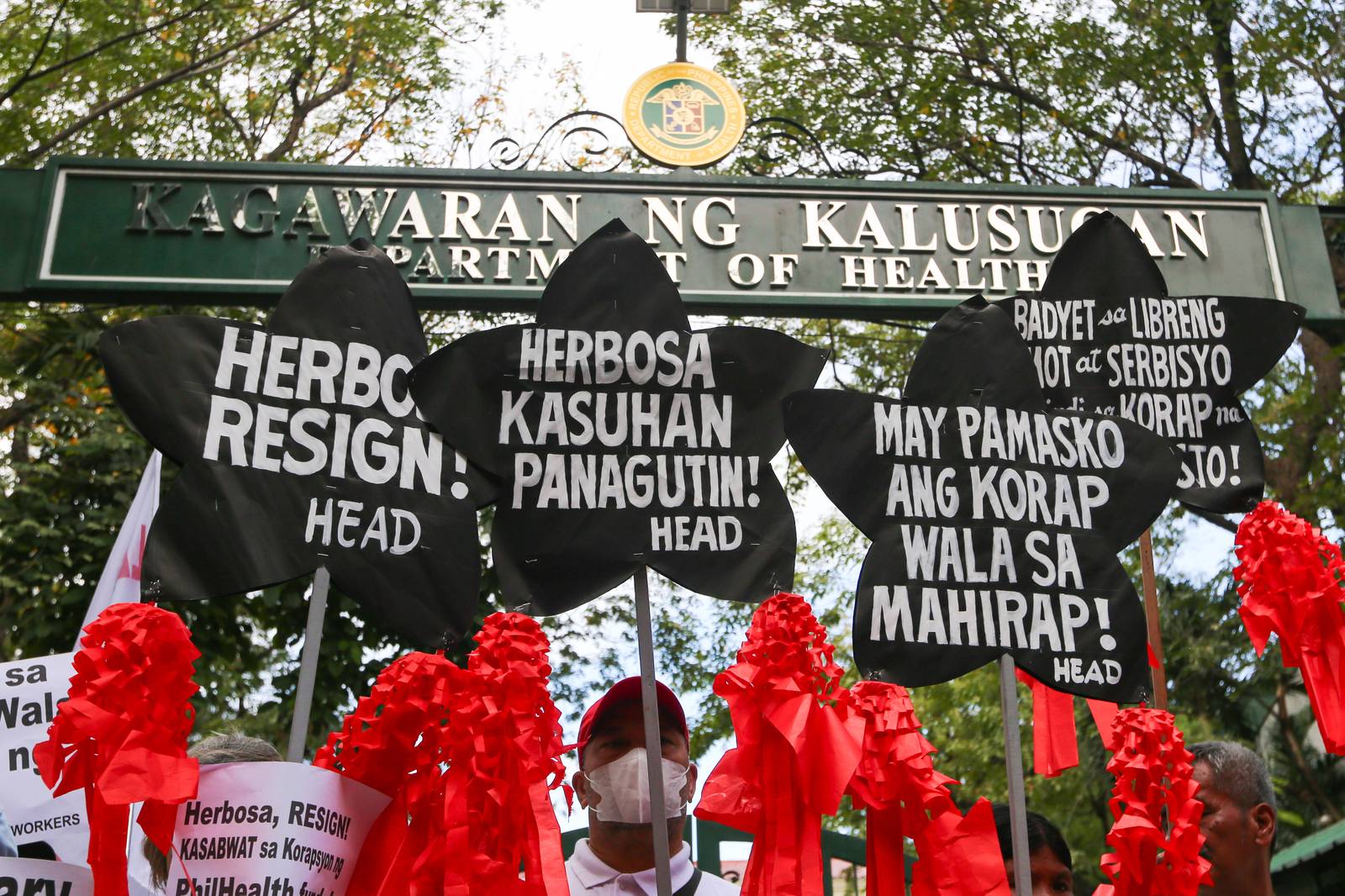 Health advocates stage a symbolic protest using Christmas lanterns outside the Department of Health office in Santa Cruz, Manila on Monday, December 15, 2025, calling for the resignation of Health Secretary Teodoro Herbosa amid alleged anomalies at the agency. The group also pressed for transparency and accountability in the use of the ₱60-billion PhilHealth budget.