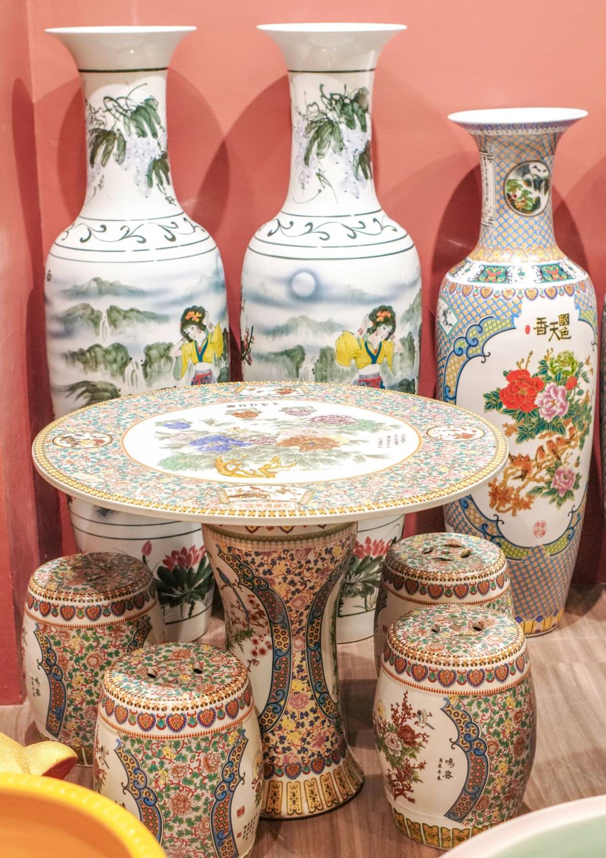 HAND-PAINTED vases and ceramic furniture reflecting classical Chinese artistry.
