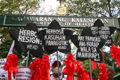 Health advocates stage lantern protest vs DOH chief, PhilHealth fund use
