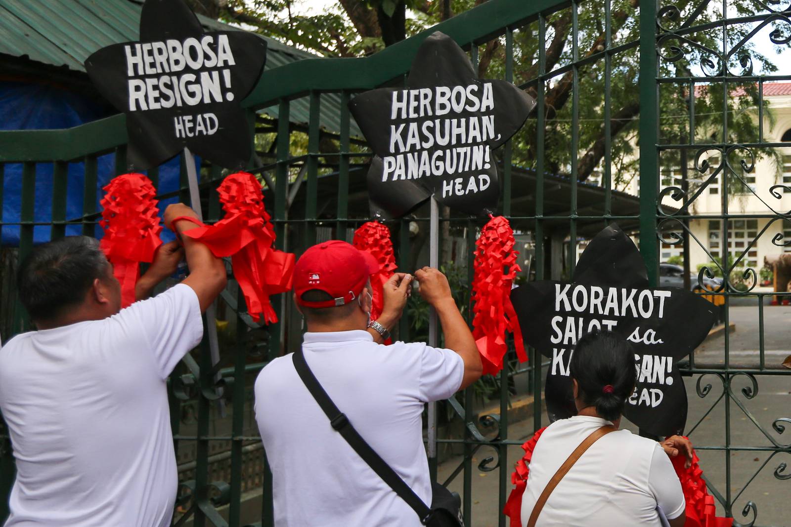 Health advocates stage a symbolic protest using Christmas lanterns outside the Department of Health office in Santa Cruz, Manila on Monday, December 15, 2025, calling for the resignation of Health Secretary Teodoro Herbosa amid alleged anomalies at the agency. The group also pressed for transparency and accountability in the use of the ₱60-billion PhilHealth budget.