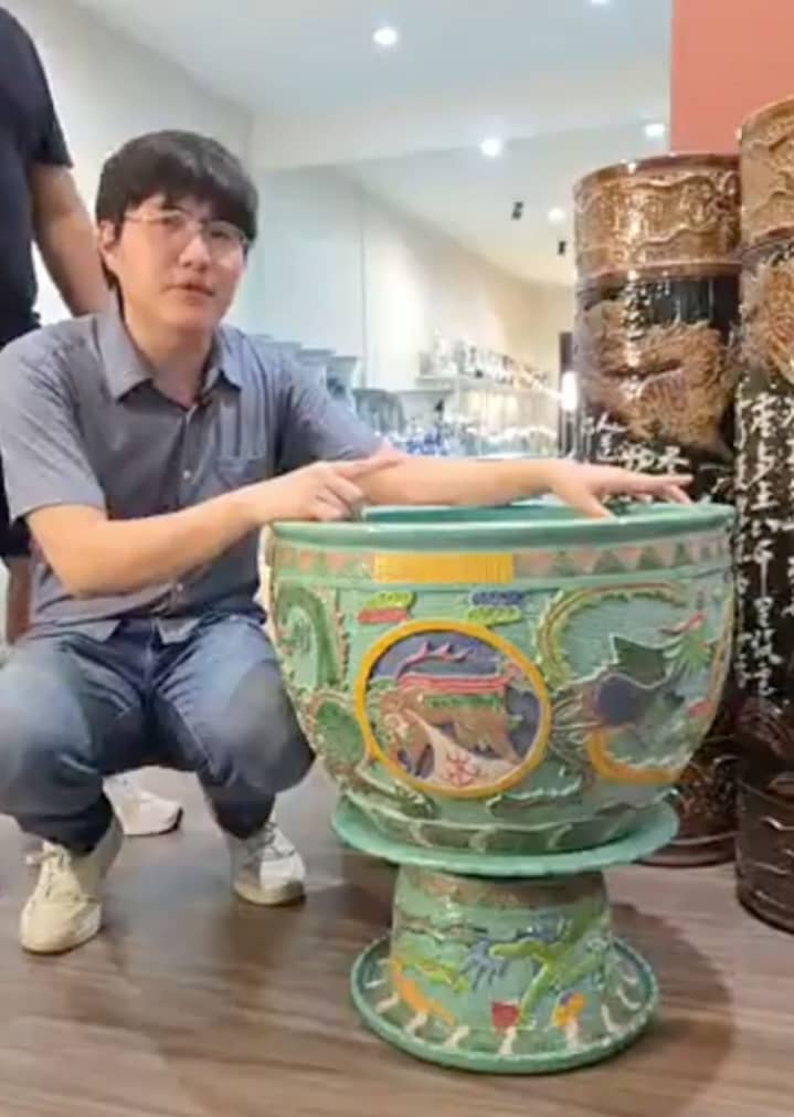 CURATOR Elrich Que shows an expensive green spinning vase pot, used by elite families in old China.