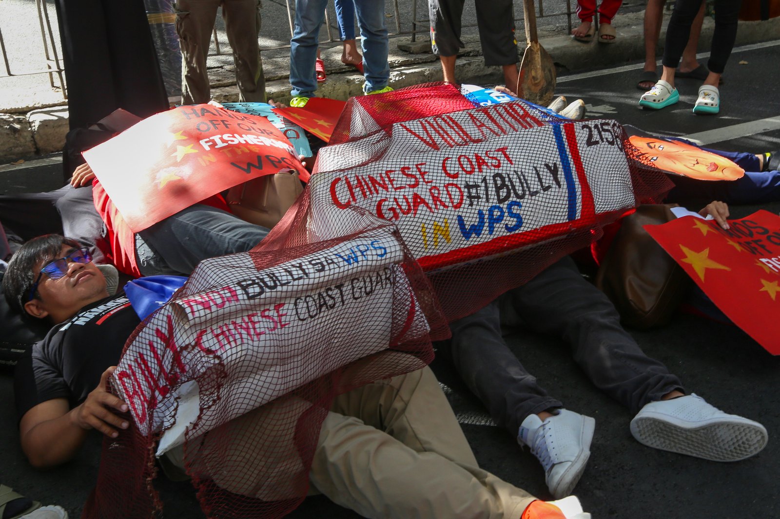 Protesters gather outside the Chinese Consular Office in Makati on 16 December 2025, to condemn the recent violent and dangerous use of water cannons and continued harassment by the Chinese Coast Guard against Filipino fishermen in Escoda Shoal, which is within the Exclusive Economic Zone (EEZ) of the Philippines.