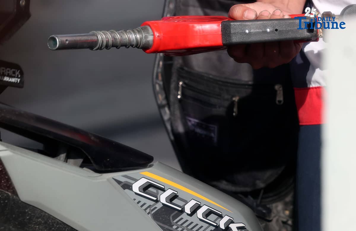 (December 16 2025) A gasoline attendant wearing a Santa Claus hat fills up vehicles of their customer at a gasoline station along EDSA in Cubao, Quezon City on Tuesday, December 16, 2025. Pump prices are set to adjust by oil companies starting Tuesday, with gasoline hike prices by P0.20 per liter, while diesel and kerosene prices will roll back by P0.20 per liter. Photo/Analy Labor