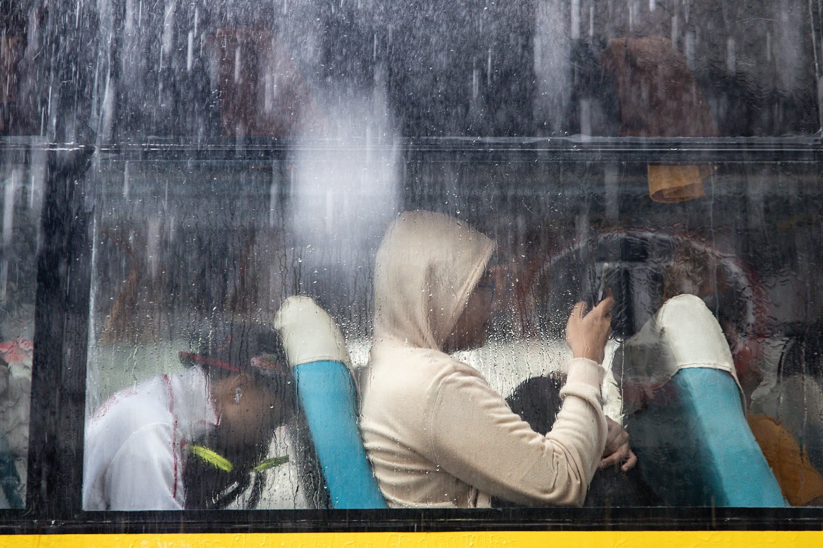 Commuters navigate the streets following a sudden heavy downpour along Taft Avenue in Manila on Tuesday, 16 December 2025. The short but intense rain resulted to some areas being in gutter-deep flood.