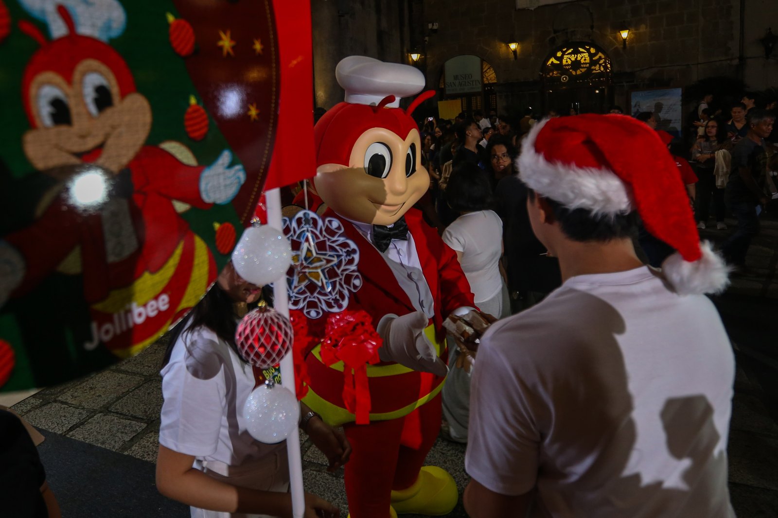 Catholic devotees flock to San Agustin Church to attend the first day of Simbang Gabi in Intramuros, Manila, on 16 December 2025. Churchgoers are then treated to a free hamburger and refreshments after the mass.