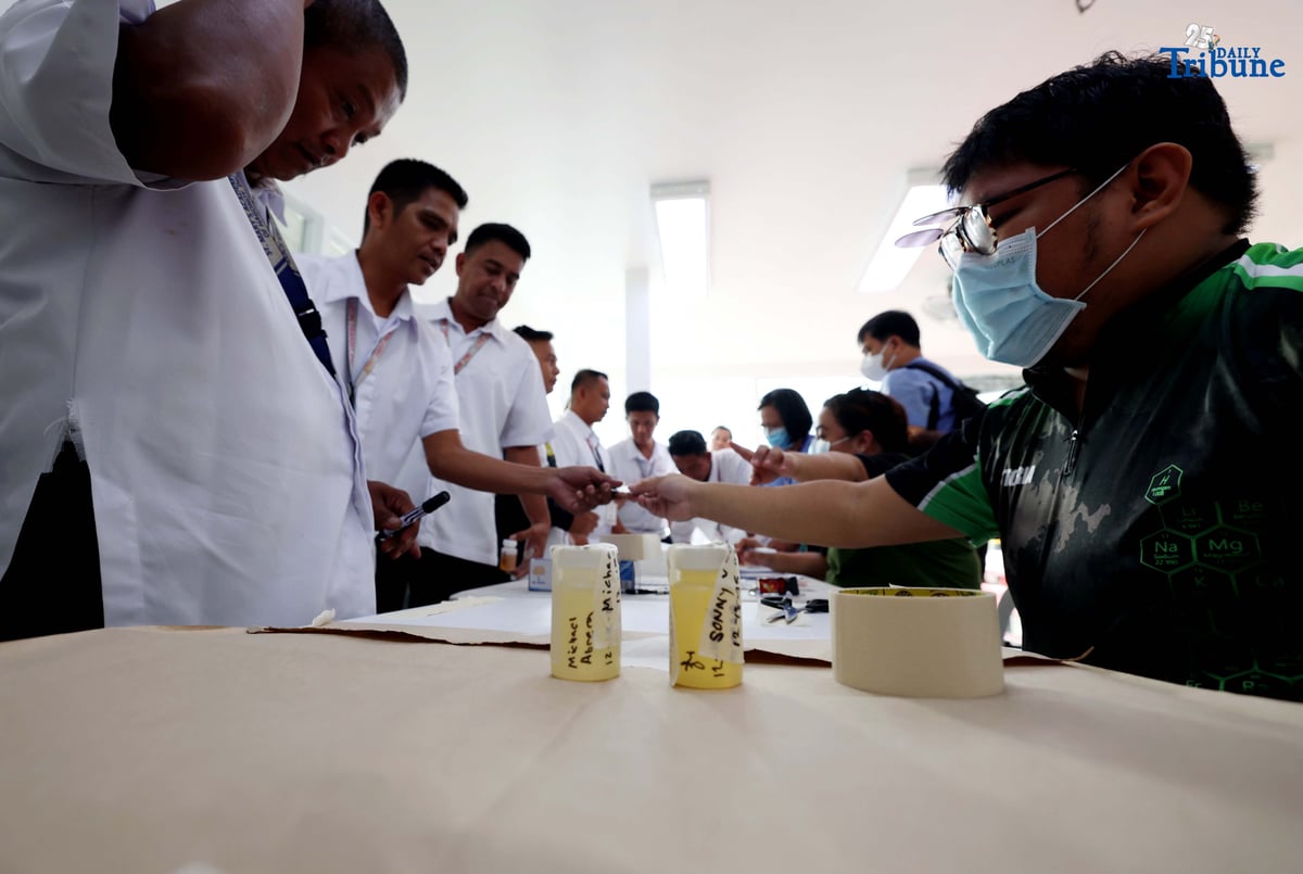 A provincial bus driver undergoes a random drug test conducted by the Philippine Drug Enforcement Agency during a joint inspection of bus terminals by the Metropolitan Manila Development Authority, Department of Transportation, Land Transportation Office, and Land Transportation Franchising and Regulatory Board in Cubao, Quezon City. The inter-agency operation is part of efforts to manage heavy holiday passenger volume and ensure commuter safety.