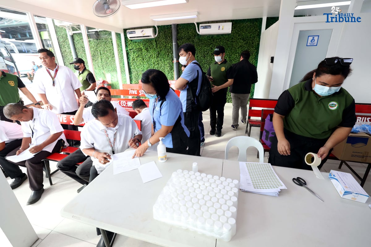 A provincial bus driver undergoes a random drug test conducted by the Philippine Drug Enforcement Agency during a joint inspection of bus terminals by the Metropolitan Manila Development Authority, Department of Transportation, Land Transportation Office, and Land Transportation Franchising and Regulatory Board in Cubao, Quezon City. The inter-agency operation is part of efforts to manage heavy holiday passenger volume and ensure commuter safety.