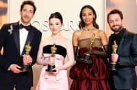 Adrien Brody, Mikey Madison, Zoe Saldaña, and Kieran Culkin pose with their Oscars backstage at the 97th Academy Awards, a quartet of winners marking the night’s defining performances. | Arturo Holmes