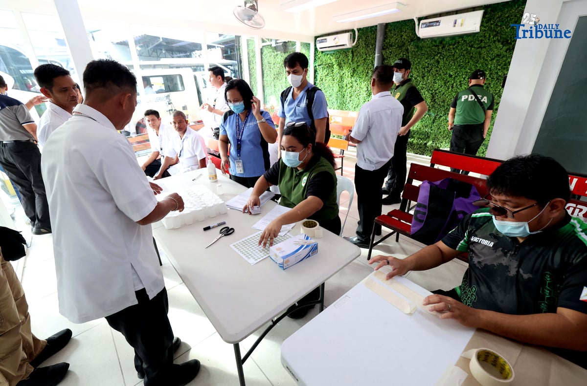 A provincial bus driver undergoes a random drug test conducted by the Philippine Drug Enforcement Agency during a joint inspection of bus terminals by the Metropolitan Manila Development Authority, Department of Transportation, Land Transportation Office, and Land Transportation Franchising and Regulatory Board in Cubao, Quezon City. The inter-agency operation is part of efforts to manage heavy holiday passenger volume and ensure commuter safety.