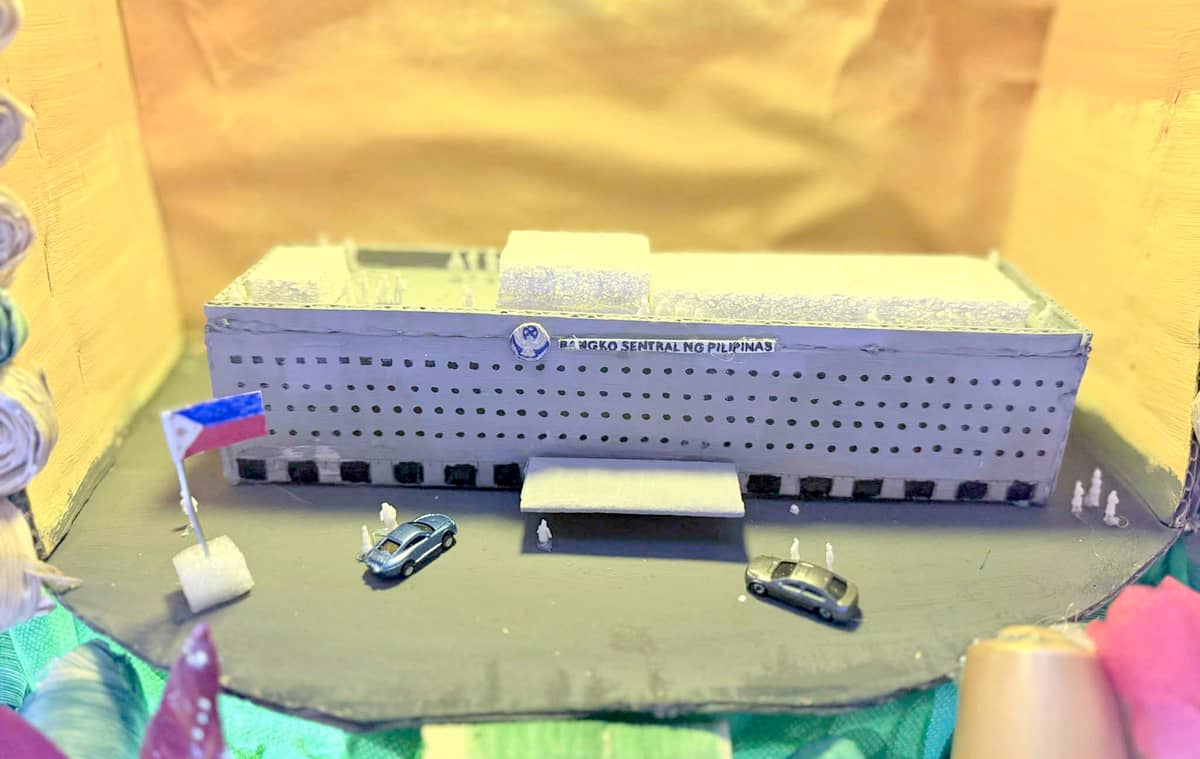 INTRICATE miniatures of the BSP Complex diorama made from cardboards, clay, Styrofoam, and repurposed toys in “Puno ng Biyaya” Christmas Tree.