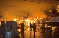FIRE fighters race against time to douse a warehouse fire in Caloocan City that broke out at 4:21 a.m. on Sunday. The fire, fueled by combustible plastic materials, reached a third alarm before being brought under control at 8:50 a.m.