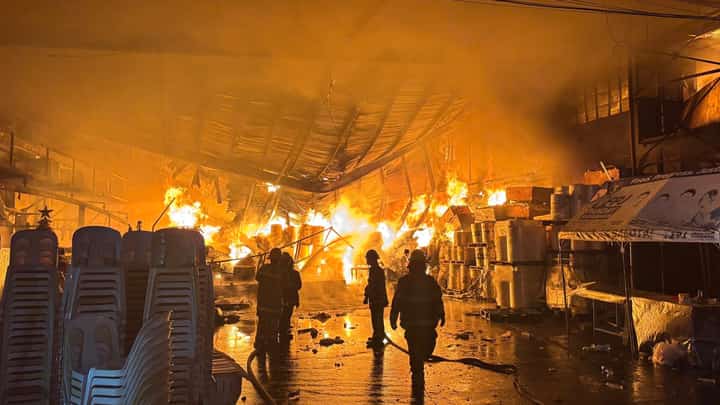 FIRE fighters race against time to douse a warehouse fire in Caloocan City that broke out at 4:21 a.m. on Sunday. The fire, fueled by combustible plastic materials, reached a third alarm before being brought under control at 8:50 a.m.