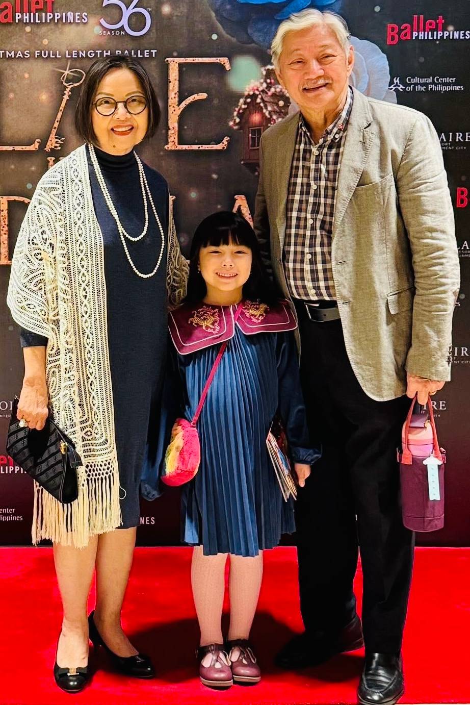 MARIE Sison-Garcia with husband Yoyet and grandchild Tala.