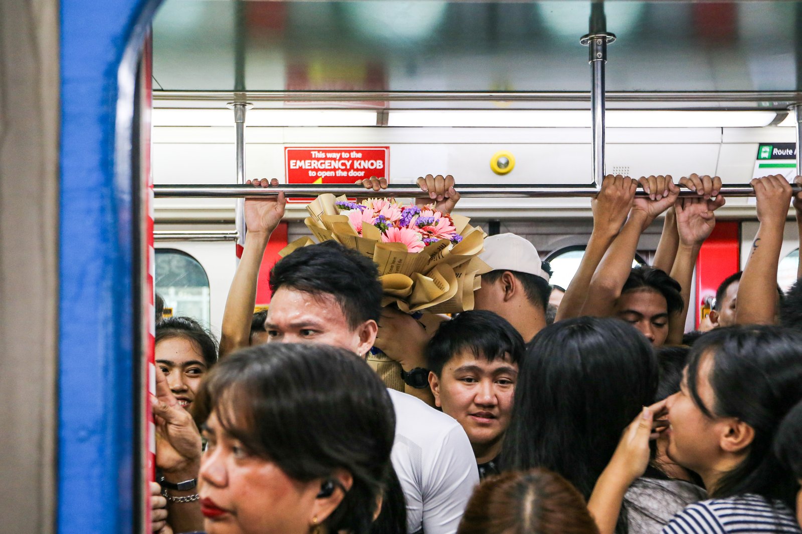 Commuters board an LRT-1 train at Doroteo Jose Station in Manila on Sunday afternoon, December 21, as the Department of Transportation rolls out its “12 Days of Christmas” free-ride program, allowing entire families to ride for free regardless of the number of members.