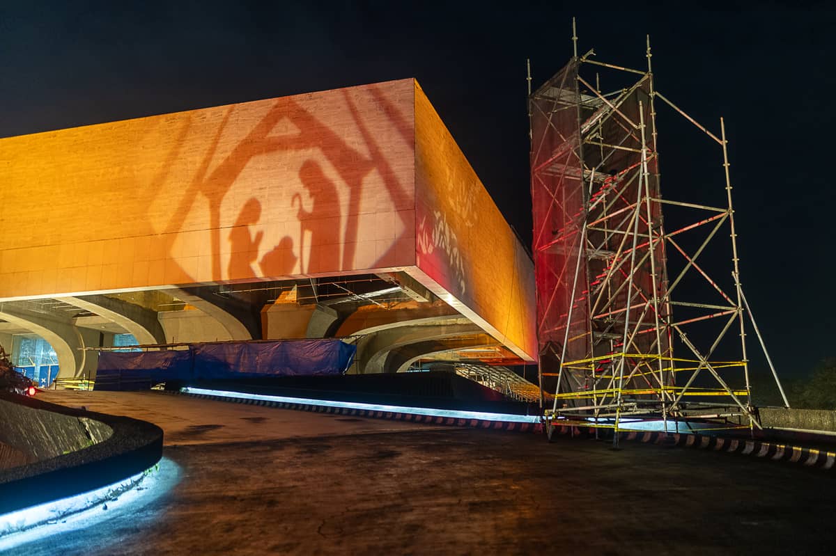 A belen silhouette cast in light anchors the installation 'Gabay,' blending faith, architecture, and renewal on the CCP’s historic facade.