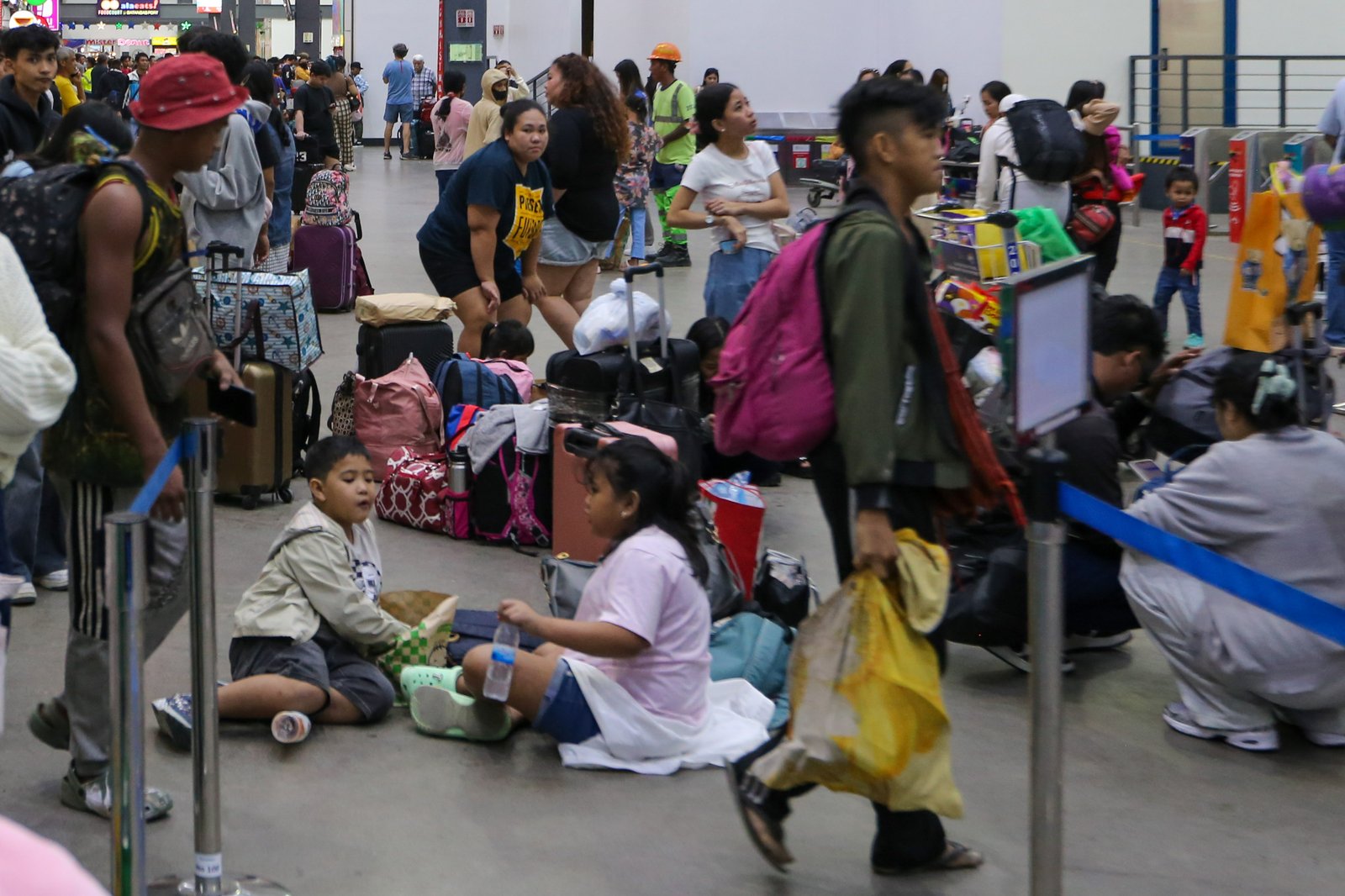 STRANDED FOR THE HOLIDAYS
Passengers wait for available trips at Batangas Port on Monday, 22 December 2025, as several shipping lines are either fully booked or delayed due to the surge of holiday travelers. With only three days left before Christmas, some fear they may spend the holidays at the port or aboard a vessel.