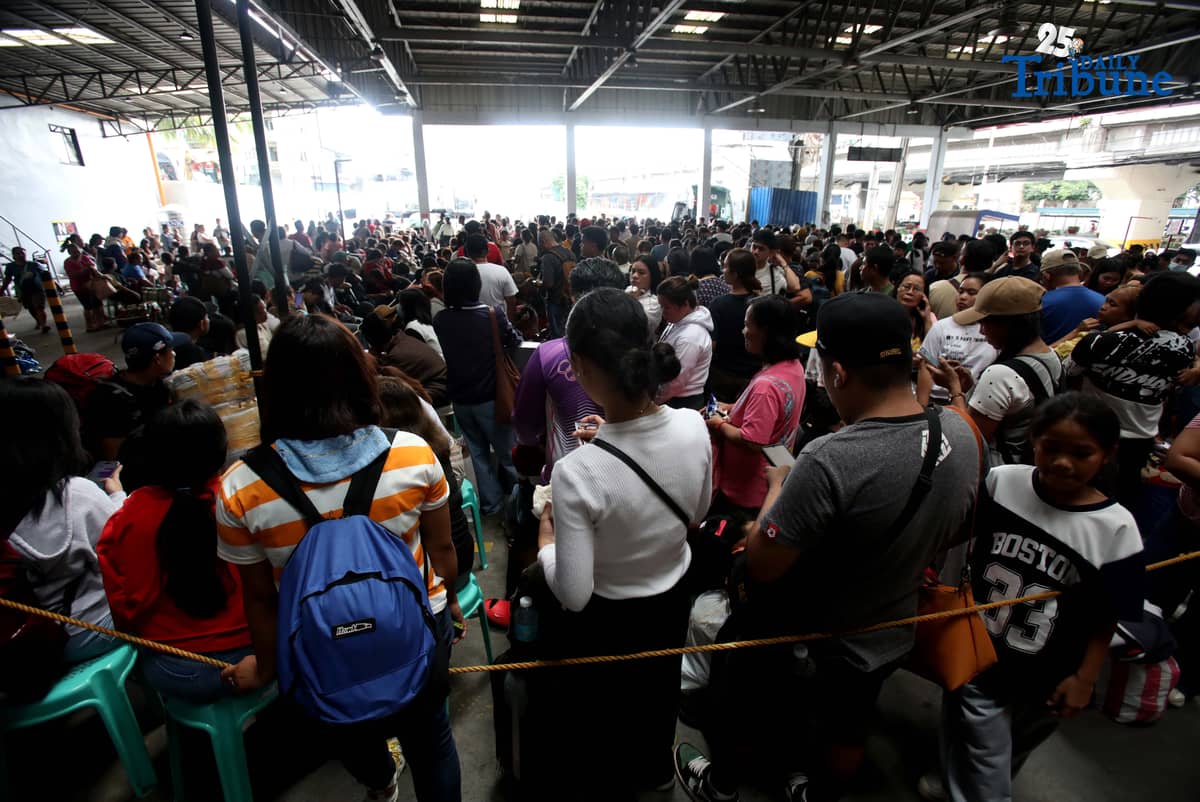 Passengers bound for their home provinces for the New Year were seen flocking to the JAC bus terminal in Quezon City on Friday, December 26, 2025.