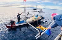 BRP Alberto Navarette (PC 394) personnel facilitated the distribution of food packs to the fisherfolk encountered during patrol operations. (Photo from Philippine Navy)