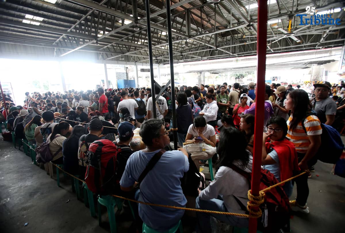 Passengers bound for their home provinces for the New Year were seen flocking to the JAC bus terminal in Quezon City on Friday, December 26, 2025.