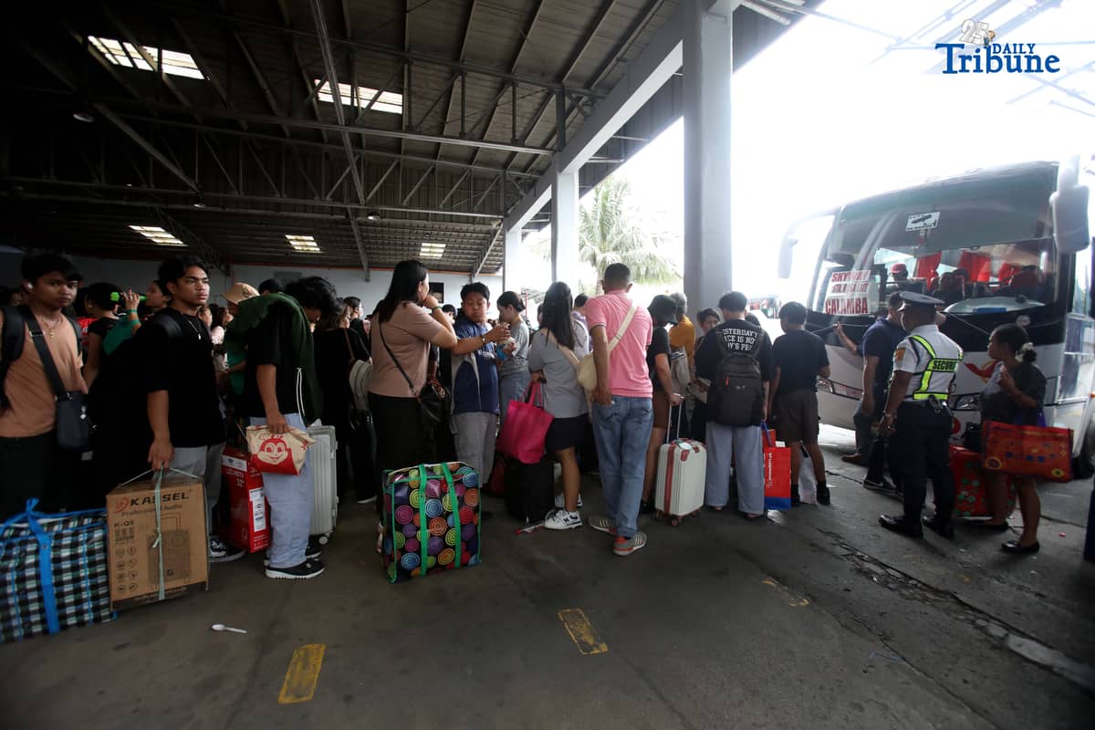 Passengers bound for their home provinces for the New Year were seen flocking to the JAC bus terminal in Quezon City on Friday, December 26, 2025.