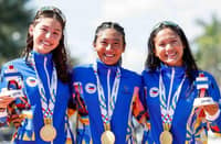 KIM Mangrobang (center) celebrates with Kira Ellis and Raven Faith Alcoseba after winning the gold medal in the women’s team relay event of the 33rd Southeast Asian Games.