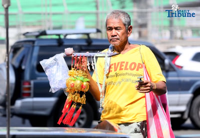 Senior citizen selling lucky charm